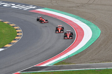 Naklejka premium Scarperia; Italy - October 24th 2025: Ferrari SF90 and SF1000 ex Sebastian Vettel and Charles Leclerc in action during Ferrari World Finals 2025 at Mugello Circuit in Italy.
