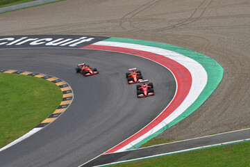 Naklejka premium Scarperia; Italy - October 24th 2025: Ferrari SF90 and SF1000 ex Sebastian Vettel and Charles Leclerc in action during Ferrari World Finals 2025 at Mugello Circuit in Italy.