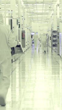 Vertical footage of workers in a Semiconductor manufacturing facility