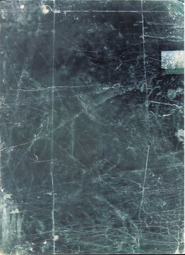 Dark grainy film texture with scratches, dust and grain effects creating authentic analog photography overlay for retro visual aesthetic in design projects