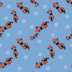Ladybugs with heart seamless pattern on blue. Unless pattern for web, for print, for fabric print, for wallpaper
