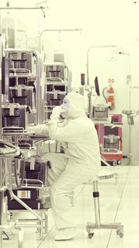 Vertical footage of workers in a Semiconductor manufacturing facility