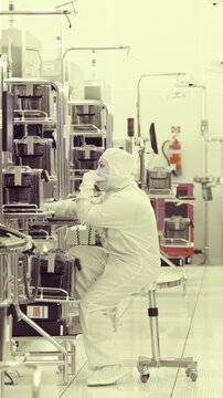 Vertical footage of workers in a Semiconductor manufacturing facility
