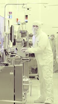 Vertical footage of workers in a Semiconductor manufacturing facility