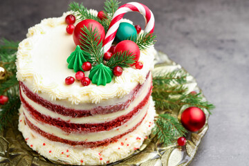 Tasty cake with Christmas decor on grey table, closeup