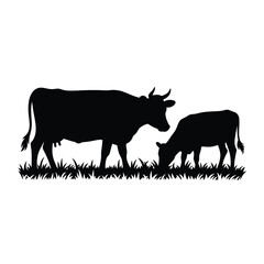 Silhouette of a cow and calf grazing in a grassy field