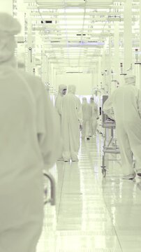 Vertical footage of workers in a Semiconductor manufacturing facility