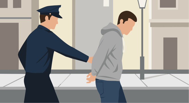 Police officer arresting a suspect on a city street, law enforcement action.