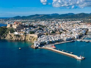 Fototapeta premium Aerial View of Dalt Vila (Eivissa Old Town) and the Busy Boat and Ferry Marina in Ibiza, Balearic Islands
