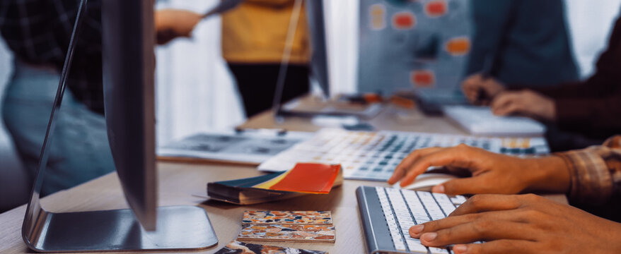 A vibrant creative workspace showcasing focused individuals engaged in design projects, surrounded by colorful materials, inspiring creativity, and promoting collaboration. SACTR - Powered by Adobe