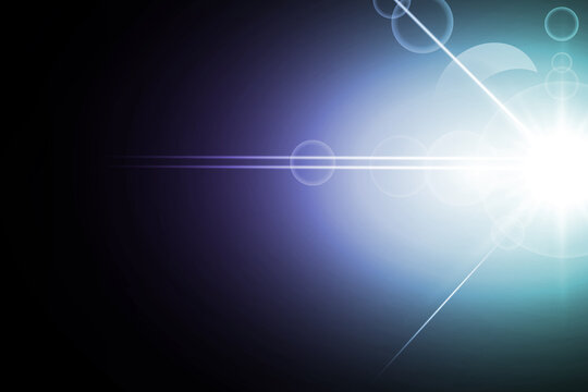 Blue and purple light flare with bright lens reflection glow isolated on black background