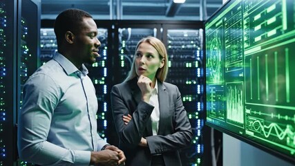 Diverse IT professionals collaborating in a data center, analyzing complex green data on a large screen, ensuring system optimization and security. - Powered by Adobe
