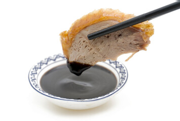 Traditional Peking Duck Slices with Cucumber, Scallion, and Sweet Bean Sauce on White Isolated Background &ndash; Chinese Cuisine