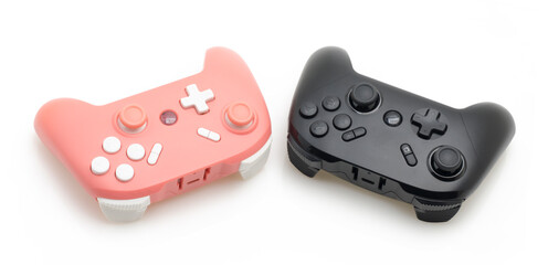 Pastel Pink and Black Gaming Controllers on White Isolated Background &ndash; Pair of Universal Gamepads for Video Games