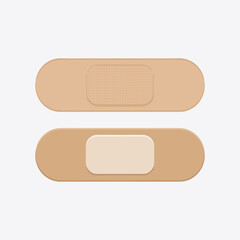 Two adhesive bandages one with textured gauze pad and one with smooth pad on a light gray background.
