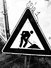 Rome, Italy - October 5, 2025, detail of a road sign: work in progress, on a triangular sign.
