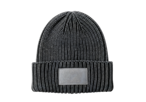 Gray knitted beanie with white label isolated on transparent background