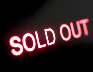 A glowing red 'SOLD OUT' sign illuminated against a dark black background.
