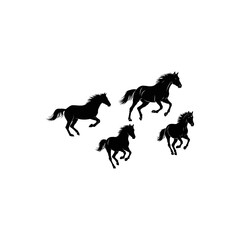 Fototapeta premium Four black horses running freely against a white background, ideal for equestrian themes, nature articles, or powerful symbolism in design.