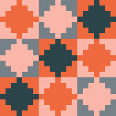 Obraz premium Stepped diamond pattern created from small orange, peach and dark grey squares in peach, light and dark grey squares