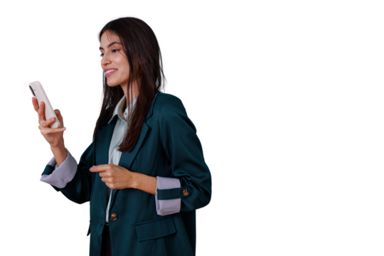 Young businesswoman holding a smartphone, looking at its screen, and pointing at the transparent background