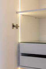 white wardrobe with drawers and led lights