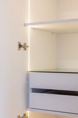 white wardrobe with drawers and led lights