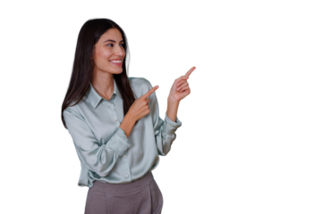 Young confident woman smiling, pointing with both index fingers to the right, showing direction or highlighting an offer