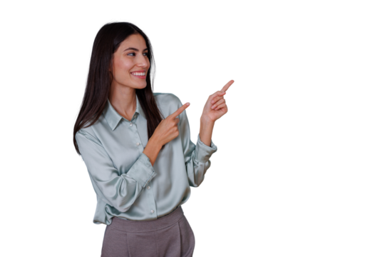 Young confident woman smiling, pointing with both index fingers to the right, showing direction or highlighting an offer