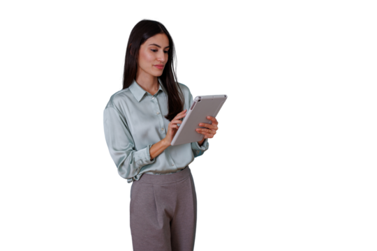 Young businesswoman standing and interacting with her digital tablet. Working with modern technology on a transparent background