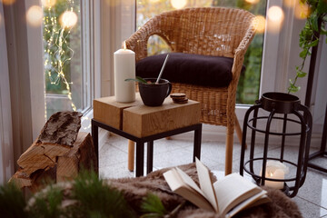 Cozy reading nook with comfortable furnishings and natural light. Background for leisure and relaxation.
