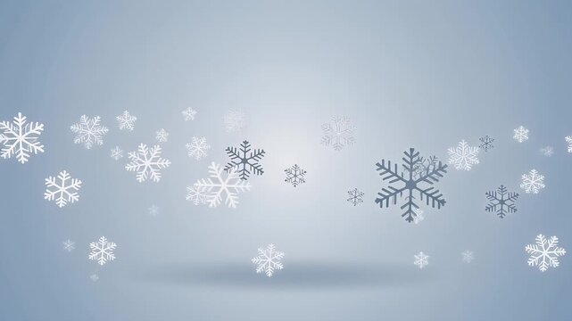 Snowflakes falling gently on a light blue background, creating a serene winter scene.