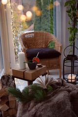 Cozy reading nook with comfortable furnishings and natural light. Vertical background for leisure and relaxation.