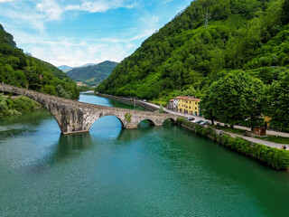 Fototapeta premium Ponte della Maddalena Devil’s Bridge over the Serchio River, Borgo a Mozzano, Tuscany, Italy