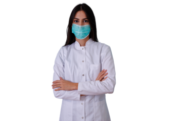 Young woman doctor or nurse wearing a face mask and medical uniform, standing with crossed arms, representing healthcare and prevention