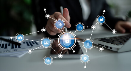 A focused business professional interacts with digital security icons, emphasizing the importance...