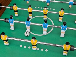 Foosball Table Close-up: Exciting Tabletop Soccer Game (Kicker/Table Football) Ready for Play.