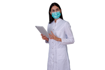 Female doctor wearing surgical mask holding digital tablet, providing medical information and modern healthcare technology