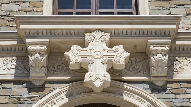 Ornate Stone Cross Carving Adorns a Classic Architectural Facade with Intricate Details.