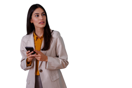 Businesswoman holding smartphone looking away, connecting with technology for communication and professional networking