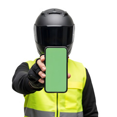 Person in helmet and safety vest holding phone with green screen against black backdrop