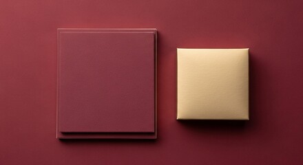 Minimalist composition of two objects against a rich red background