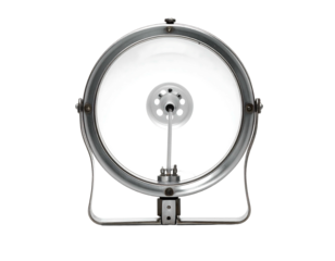 A circular silver-framed stage light with a clear lens and interior components, set against a stark black background