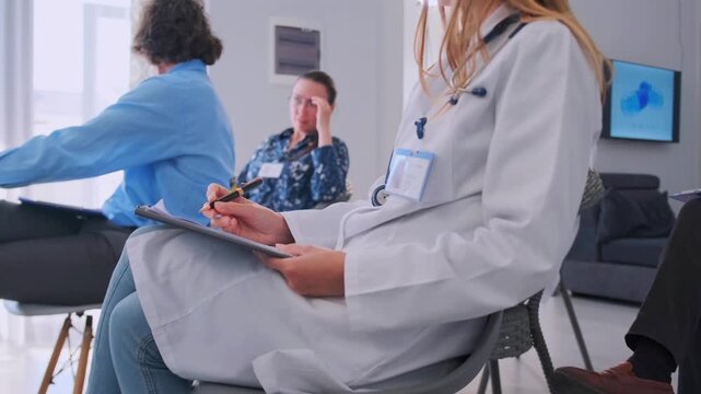 doctor records notes silently, clinician notes patient in waiting room, medical professional observes patient with attentive care, calm yet tense scene of clinician monitoring anxious patient