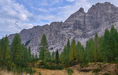 The mountain landscape of inaccessible and wild Friuli Dolomites, UNESCO Heritage Site. Nature reserves Dolomiti Friulane and Forra del Cellina. Trekking area. Autumn, clouds. Coniferous forest.