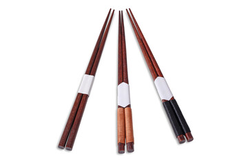 Set of three dark brown wooden chopsticks with decorative white and string-wrapped ends, arranged on a white background, ready for Asian cuisine