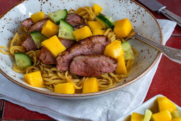 Hoisin duck with egg noodles and mango