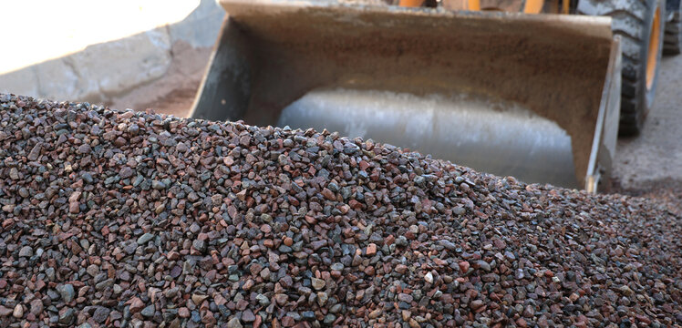Raw Gravel Piles at Concrete Mixing Plant: Industrial Construction Material Background