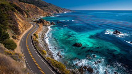 Scenic coastal road view with curving along the cliff edge with clear blue ocean 