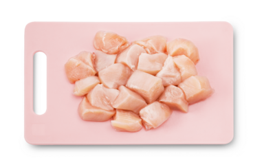 The fillet, sliced ​​into pieces, sits on a pink board made of eco-friendly plastic. white background.PNG